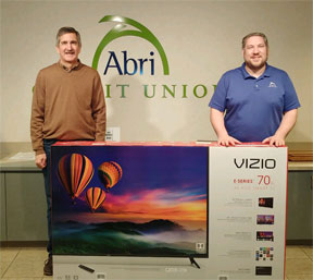 Photo - 70th Anniversary Celebration Grand Prize Winner William with Romeoville Branch Manager Kevin Whaley